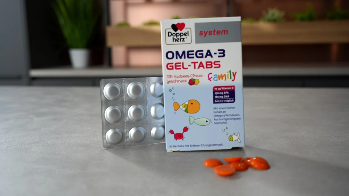 Schachtel, Blister und die orangefarbenen Gel-Tabs von Doppelherz.